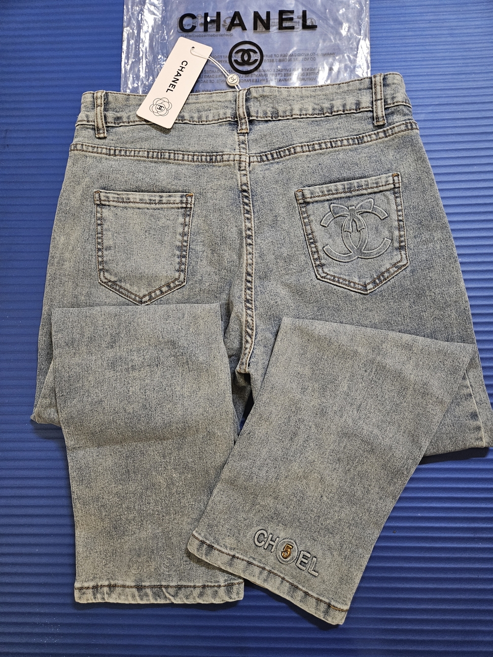 Light Blue High-Rise Women’s Jeans with Gold Button Accent - Picture 8 of 9